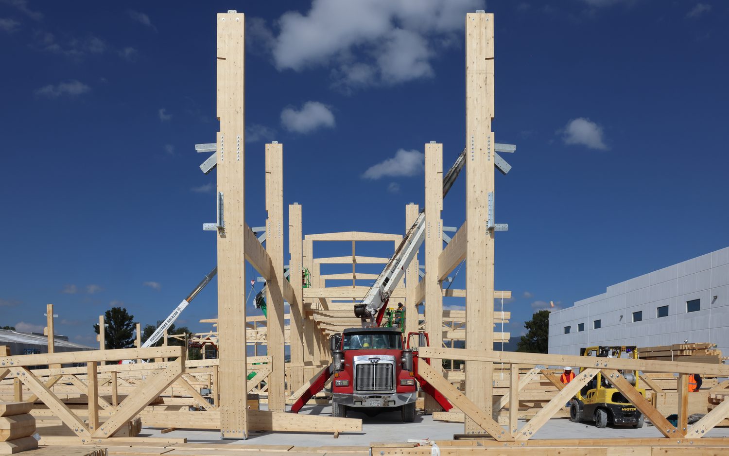 Delivery truck on the North American site between erected glulam columns